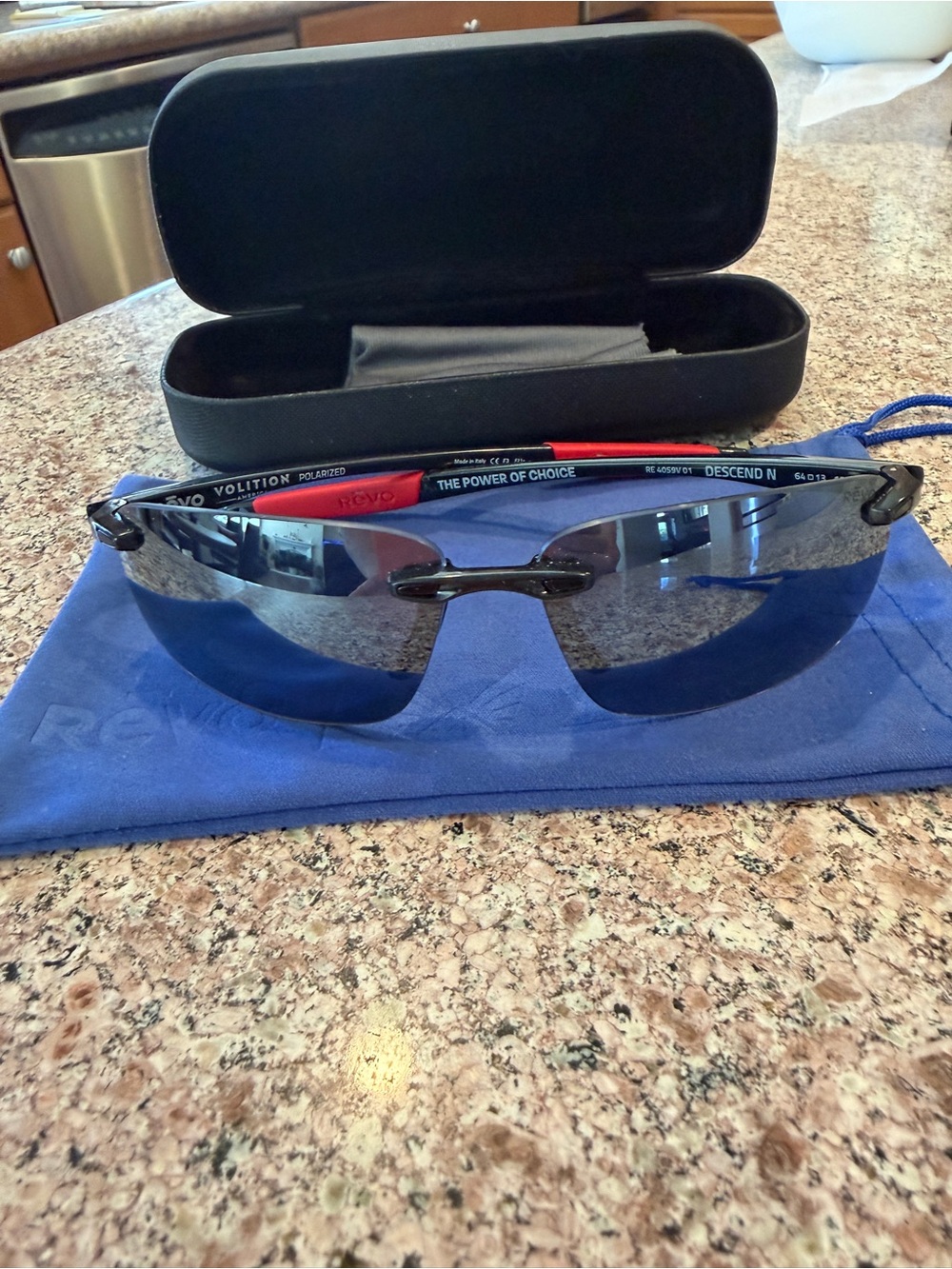 Revo Men’s Rimless Sport Sunglasses with Blue Lenses and Black Frame